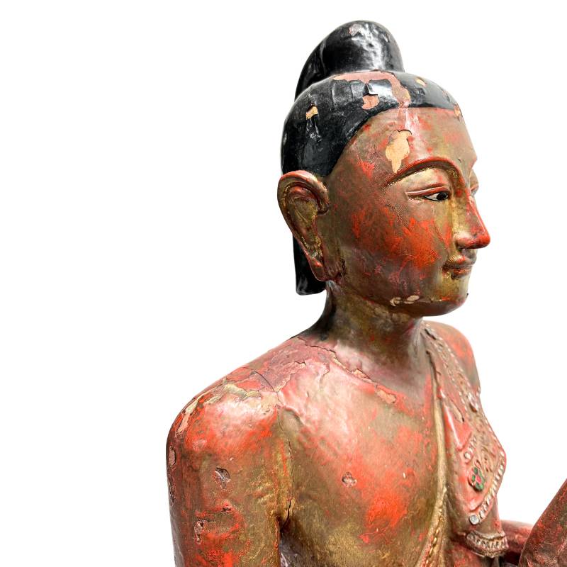 Burmese wooden sculpture with monk detail
