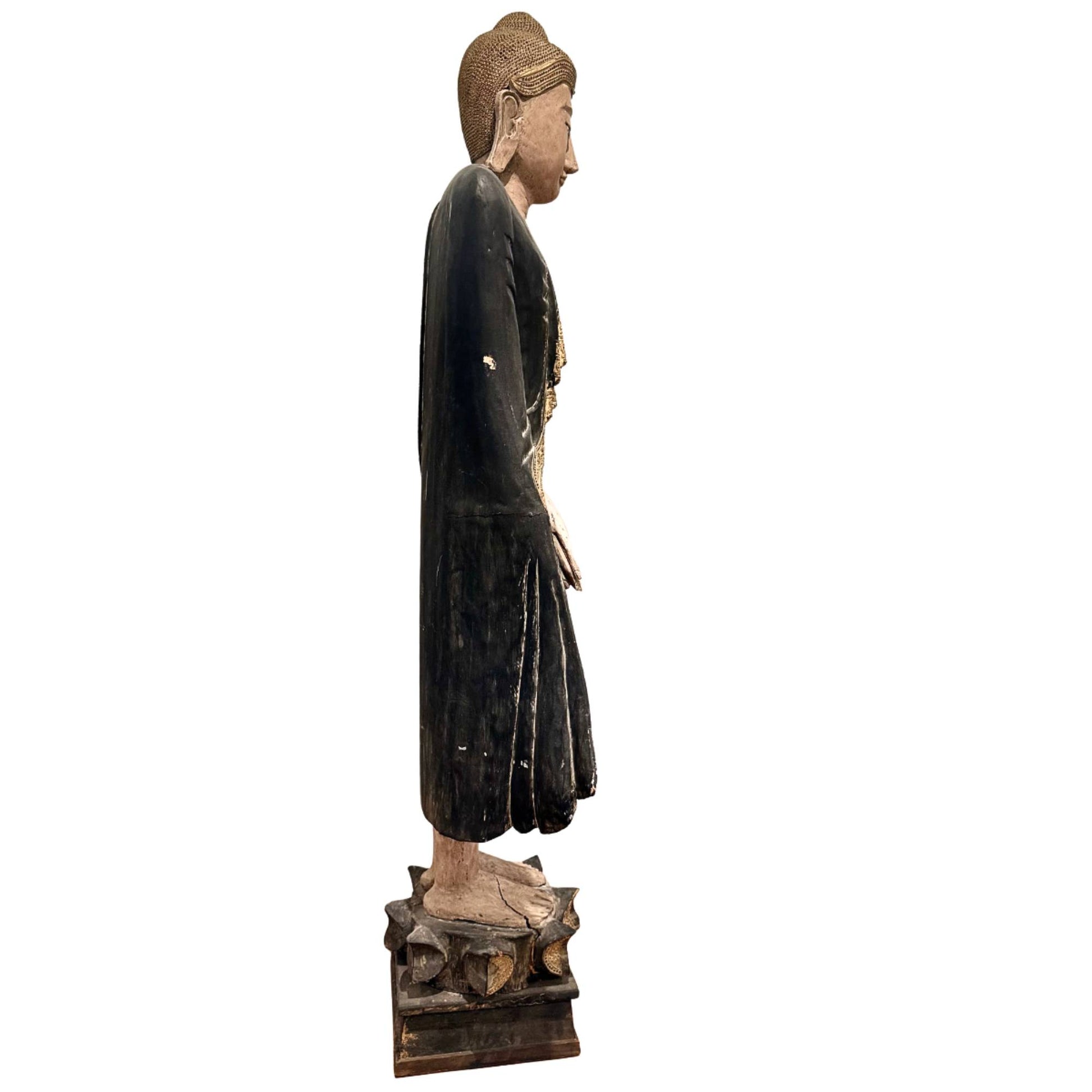 Burmese temple Buddha with black robe and golden ornaments, impressive 19th-century wooden masterpiece