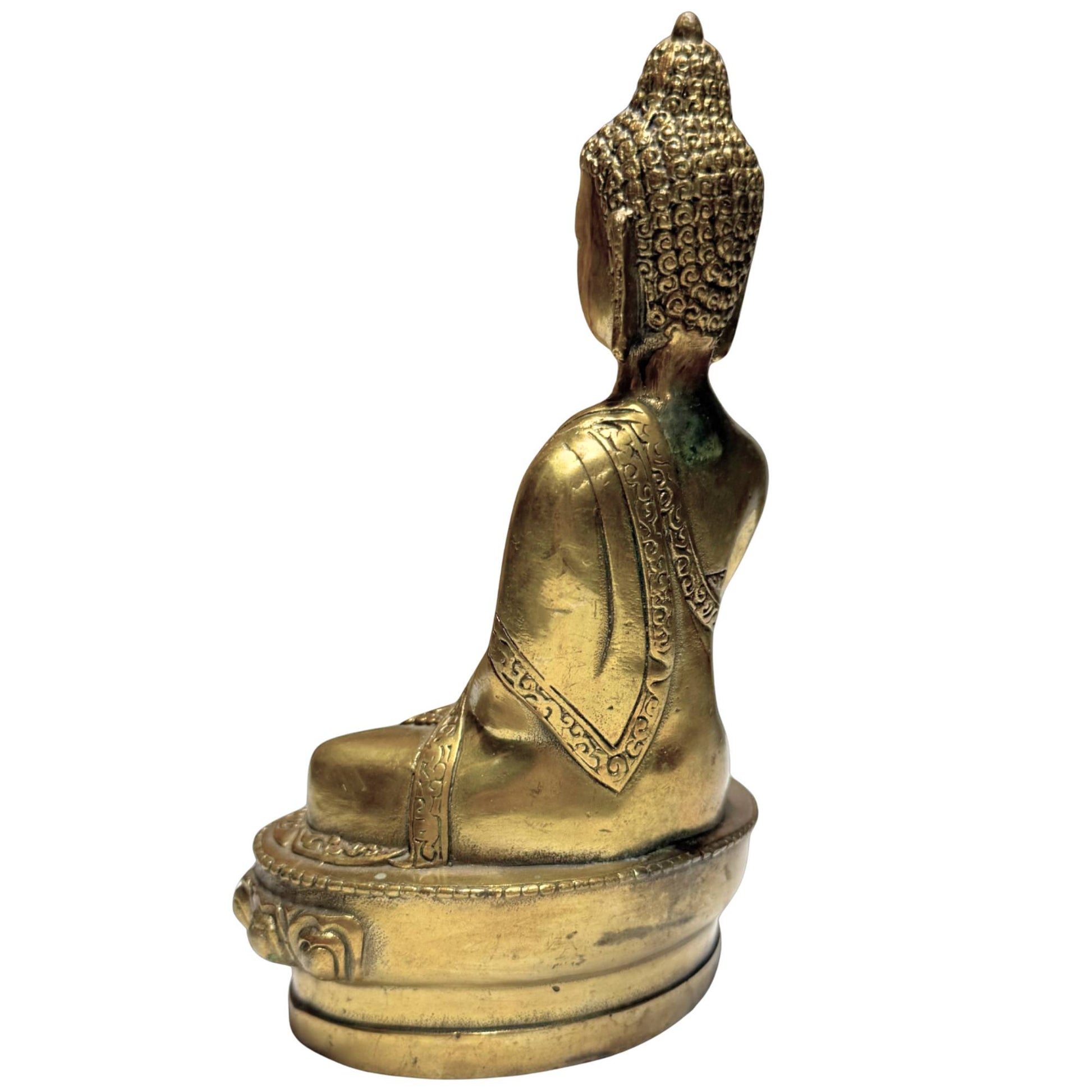 Buddha in an earth-touching posture as a sign of focus, balance, and spiritual power