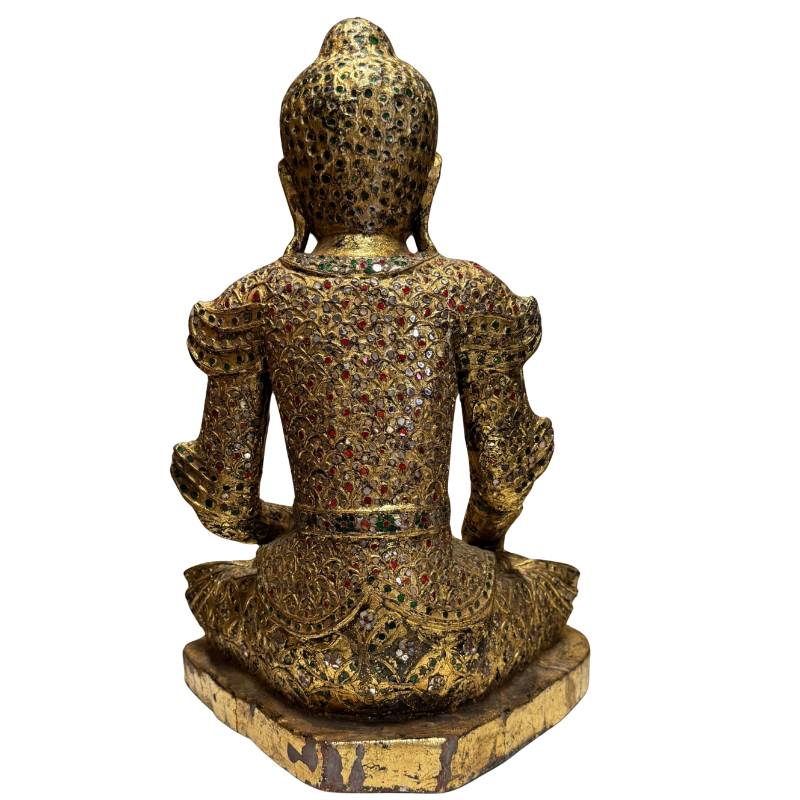Buddha statue in an earth-touching posture as a sign of enlightenment and protection