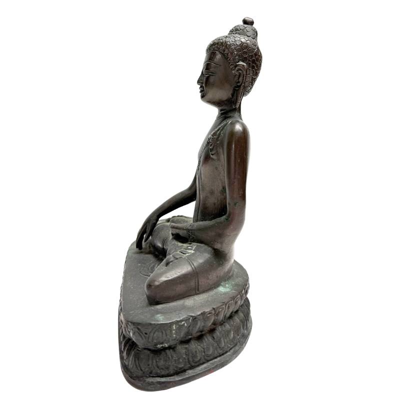 Bronze Buddha in meditation with classic Himalayan design
