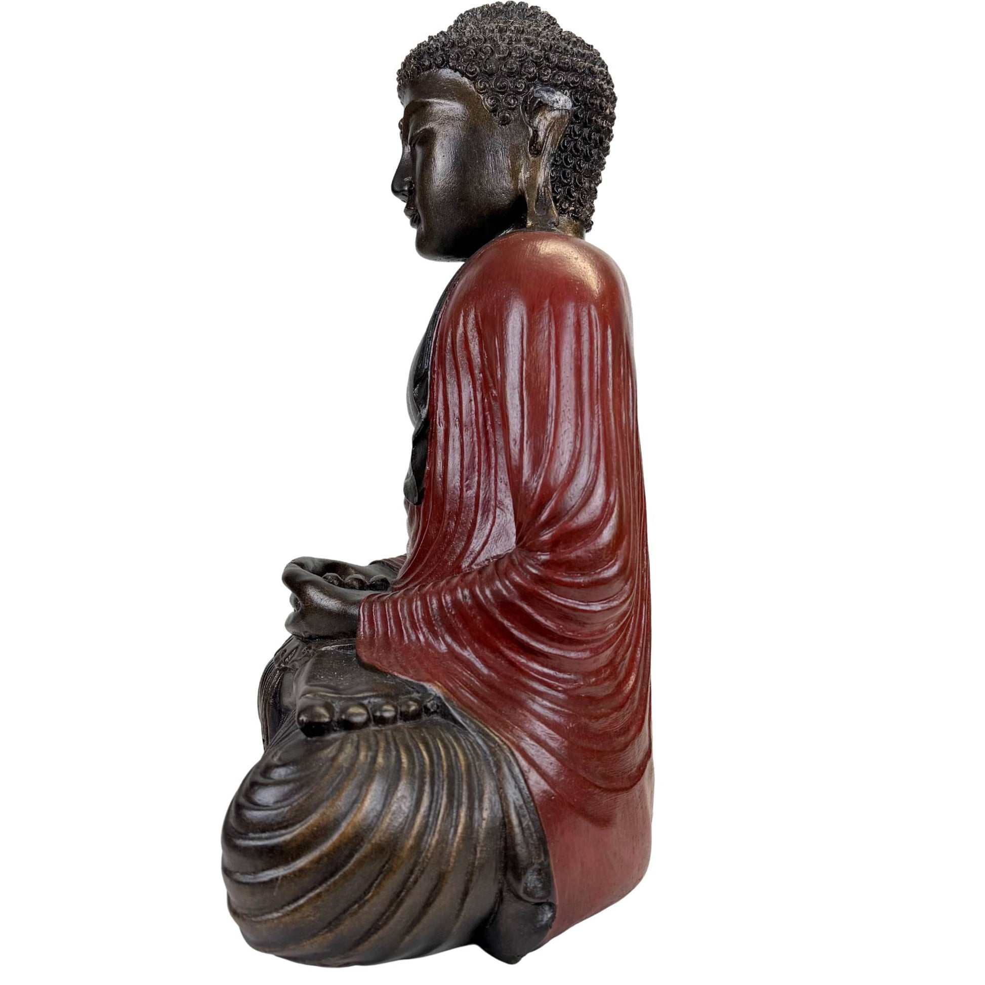Buddha statue with red robes and dark finish in Asian style