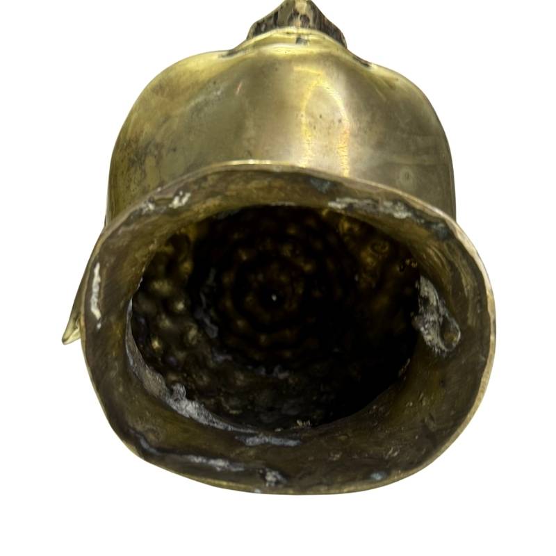 The underside of the Buddha head shows the irregular interior and evidence of hand casting.