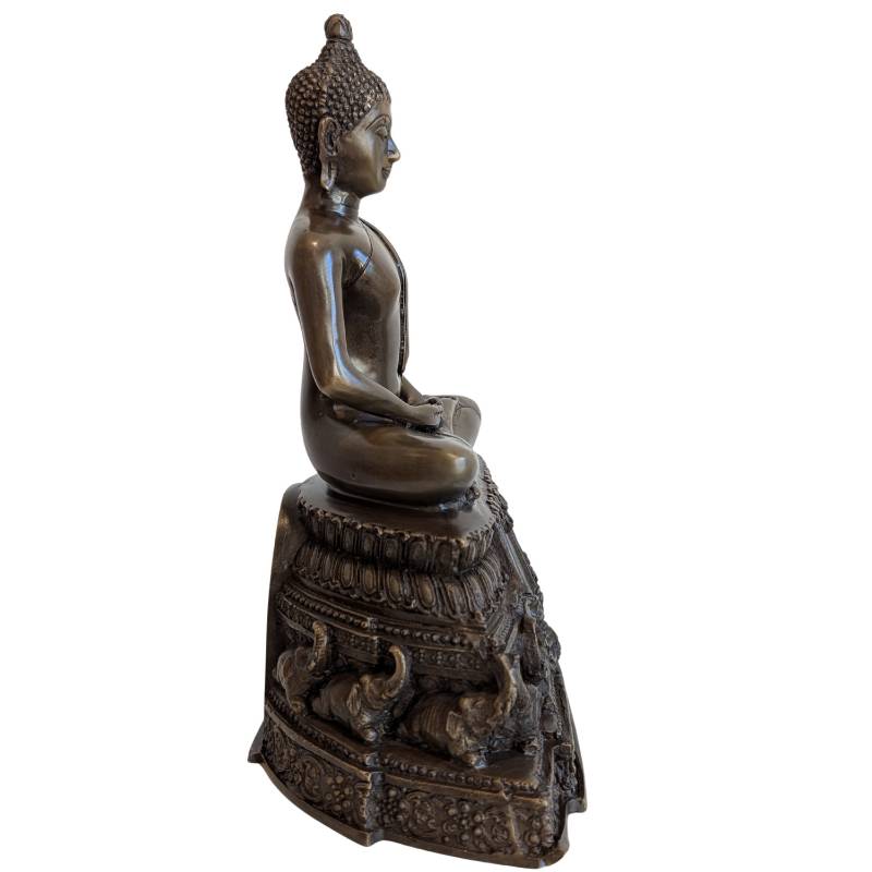 Seated Buddha in Dhyana Mudra with elephant motifs