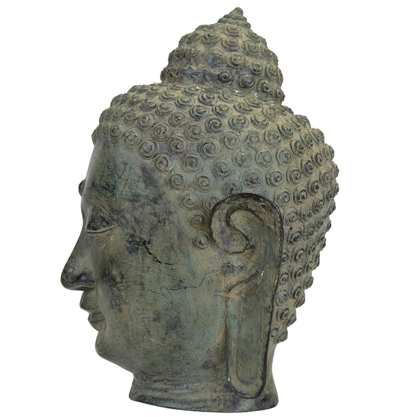 Detail of Buddha head with long earlobes and serene expression