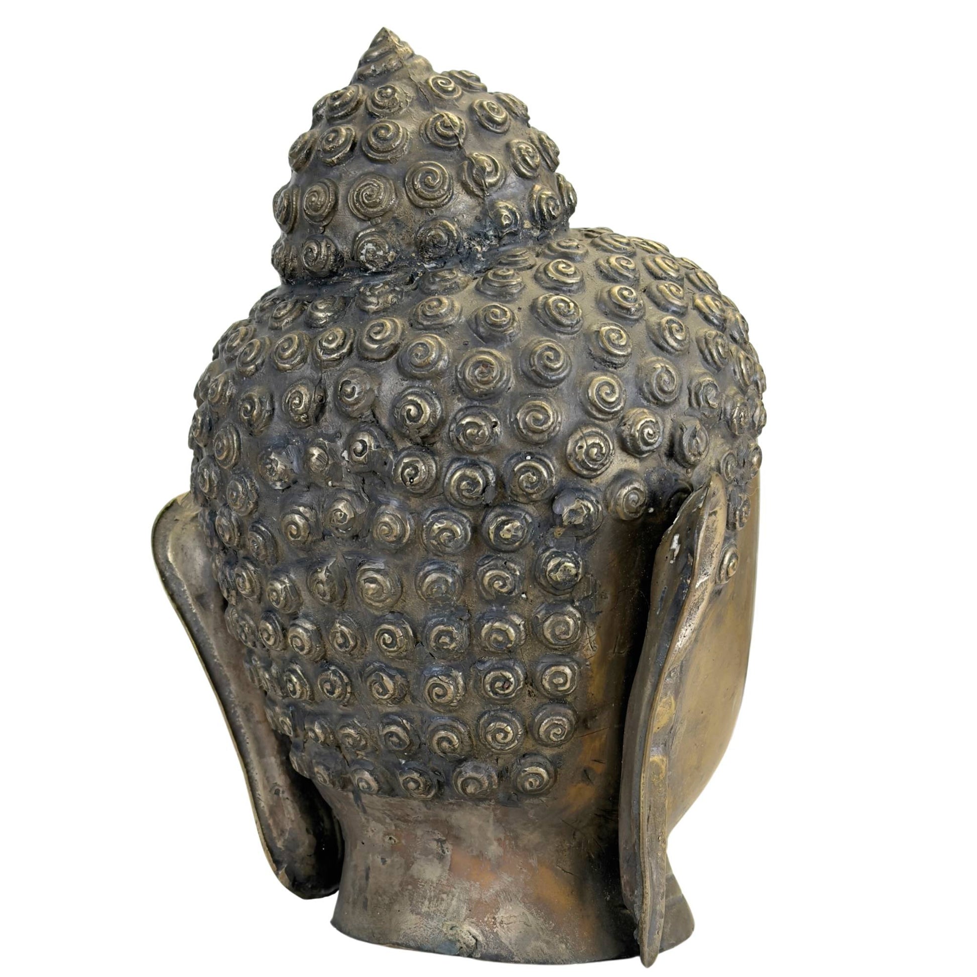 Side view of a bronze Buddha head with refined details