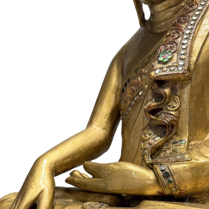 Wooden Buddha statue with an authentic appearance and gilding