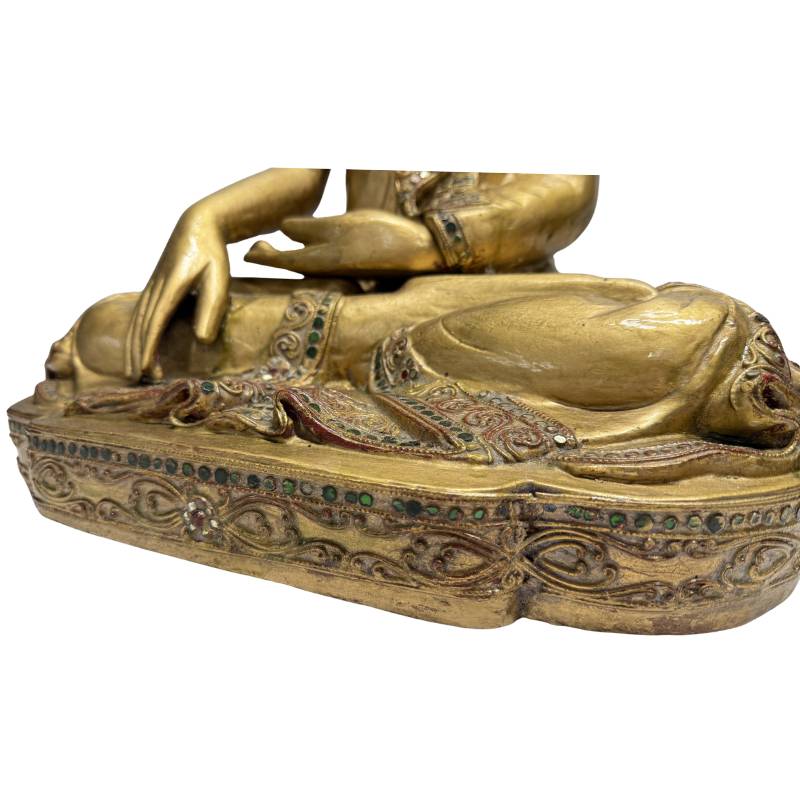 wooden Buddha statue with ornaments and gilded accents
