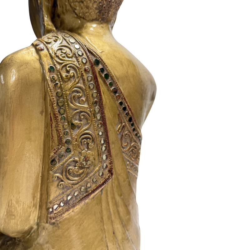 wooden Buddha statue with gilded surface and glass inlay
