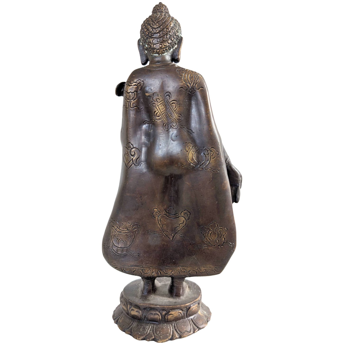 Detail of the right hand in the Varada mudra, the gesture of blessing and compassion.