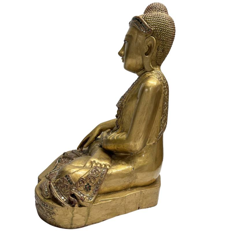 wooden Buddha statue with a calm facial expression
