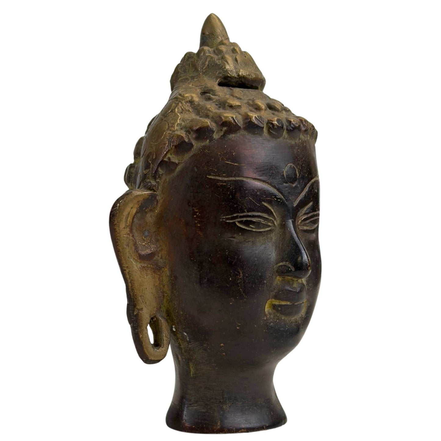 Detail of finely detailed hair curls on a bronze Buddha head