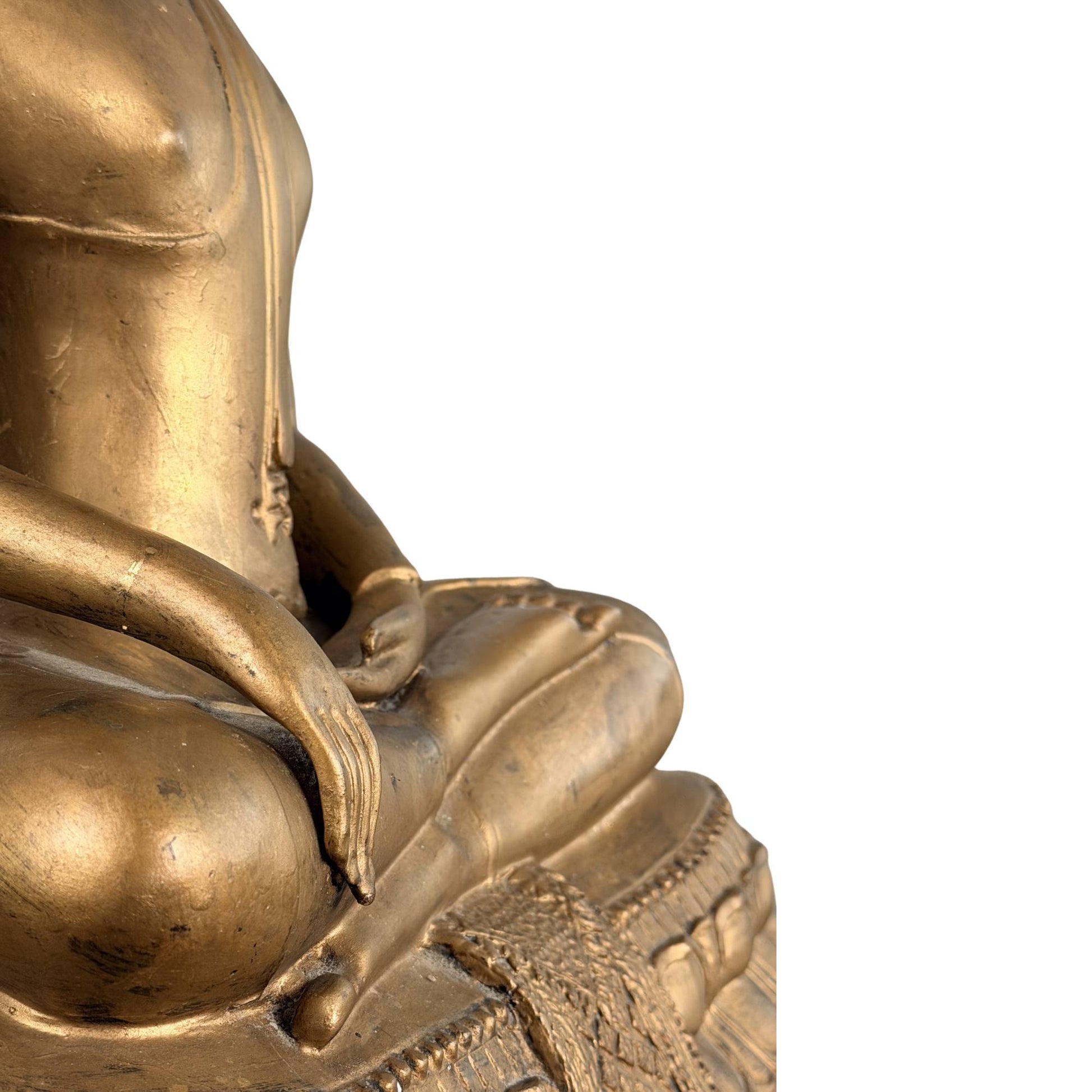 Buddhist statue from Thailand with a gold-colored patina and spiritual significance