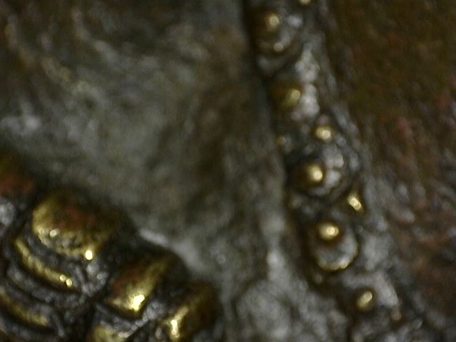 Microscope image of natural weathering of the bronze surface