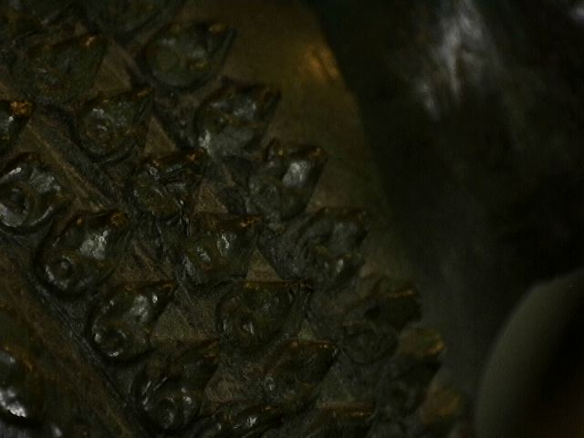 Microscope photo of microtexture and patina on Thai bronze art
