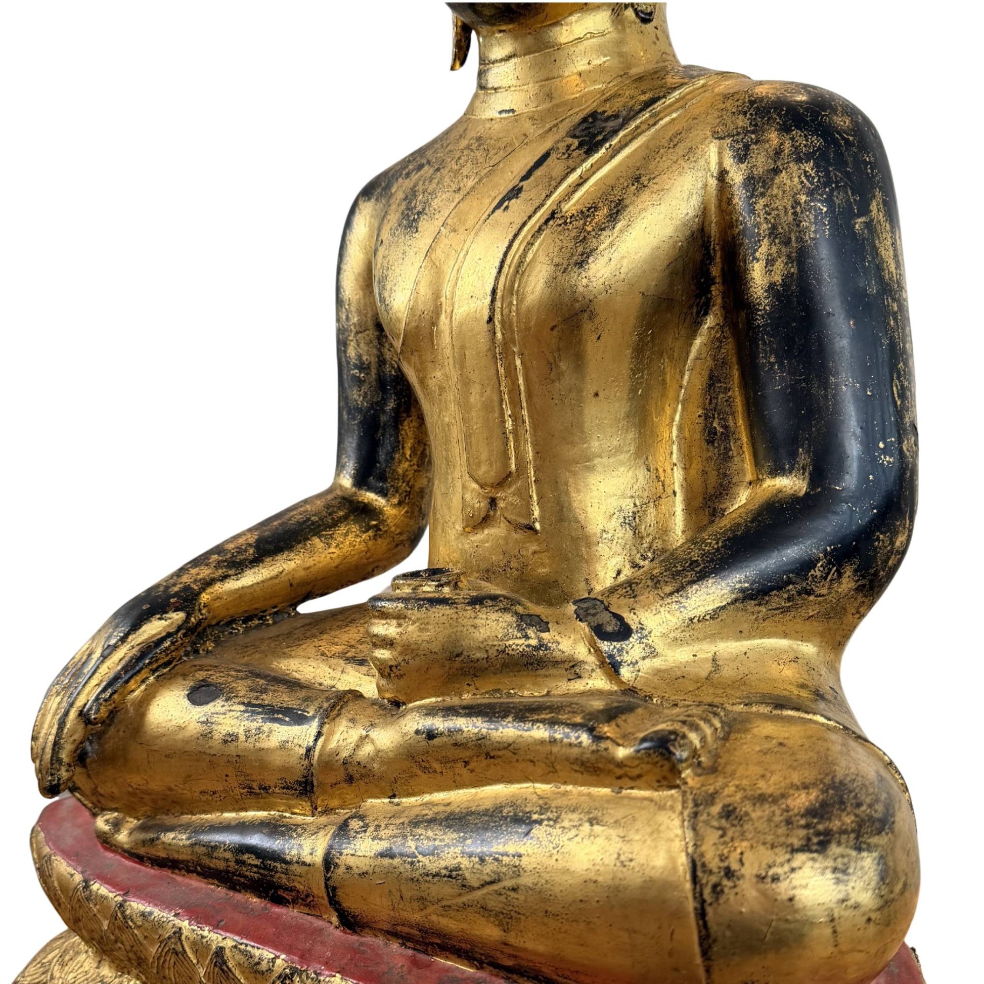 Back of bronze Buddha statue with fire gilding, black signs of wear and old patina layers