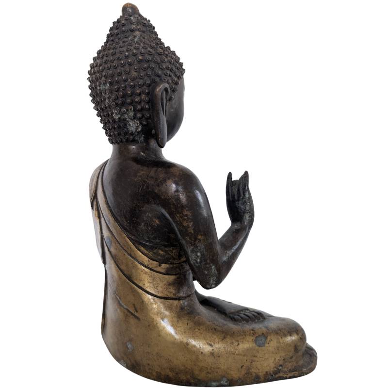Detail of Chinese bronze Buddha statue with remnants of fire gilding