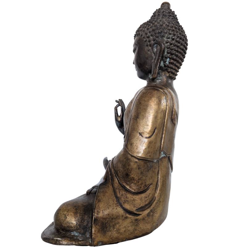 Detail of the head with hair texture and lacquer marking on a Chinese Buddha statue