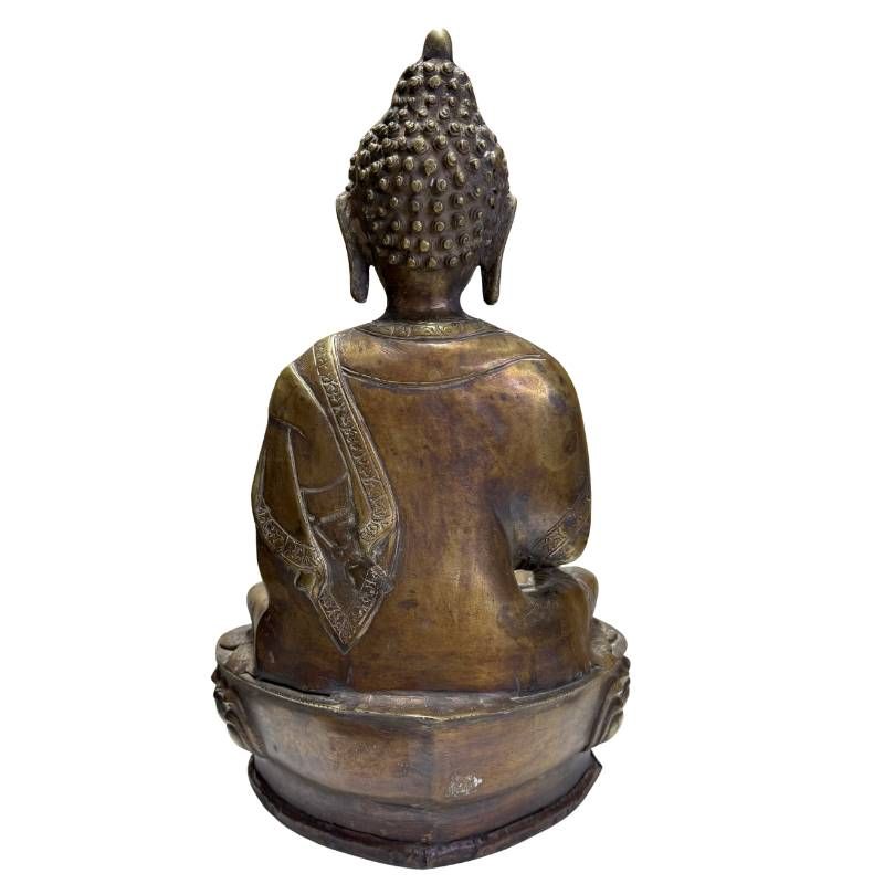 Antique bronze Buddha on a traditional lotus base with an old patina
