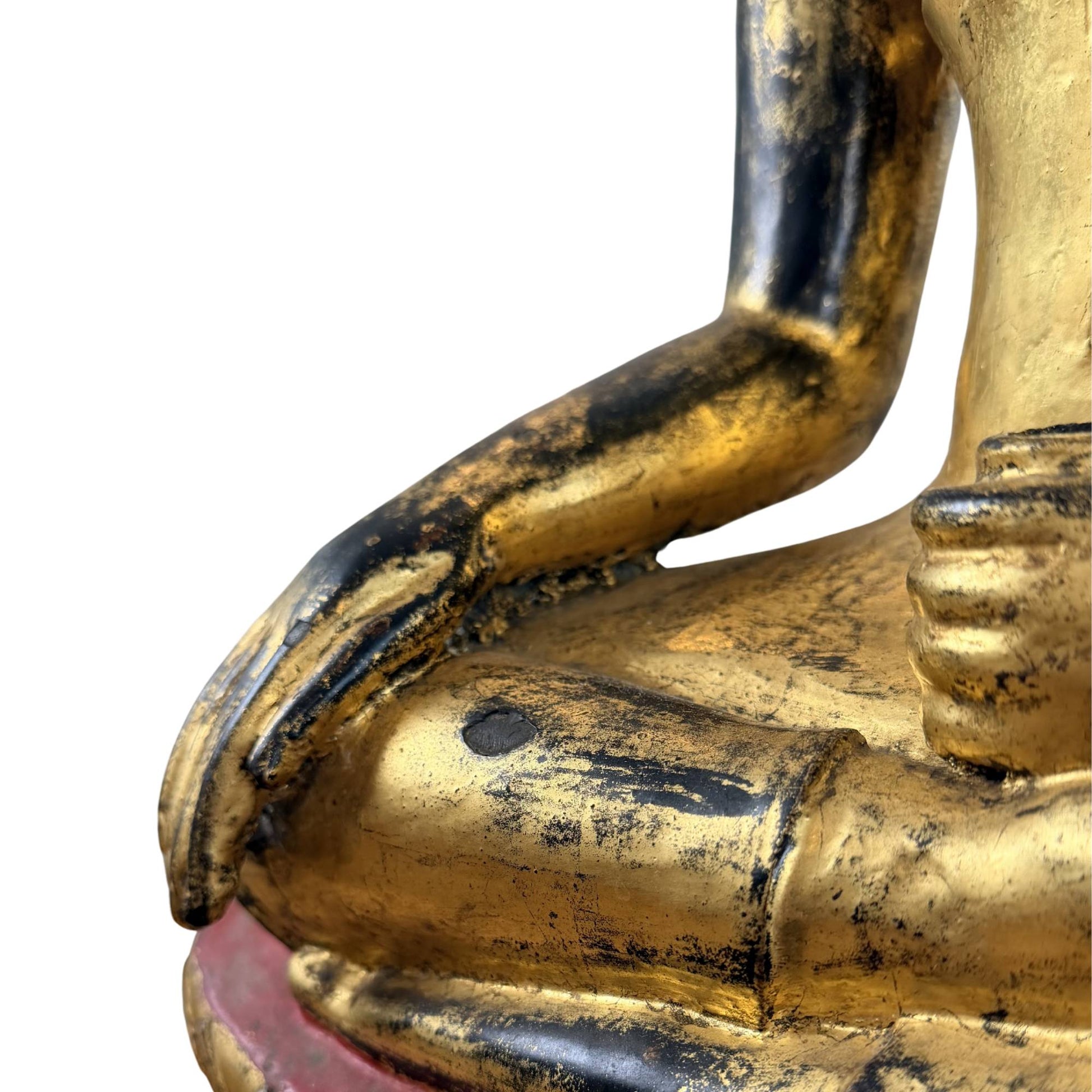 Bronze Buddha in a meditative sitting posture with fire gilding, aged wear, and meaning for peace and inner balance