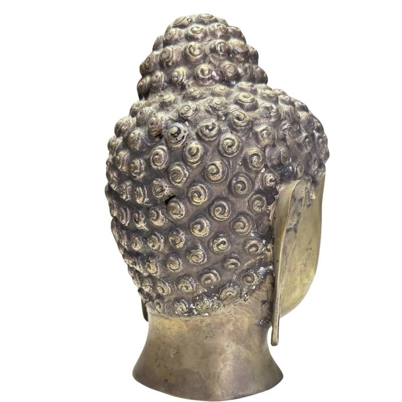 Close-up of the rear with the traditional bun (ushnisha) of the Buddha hairstyle.