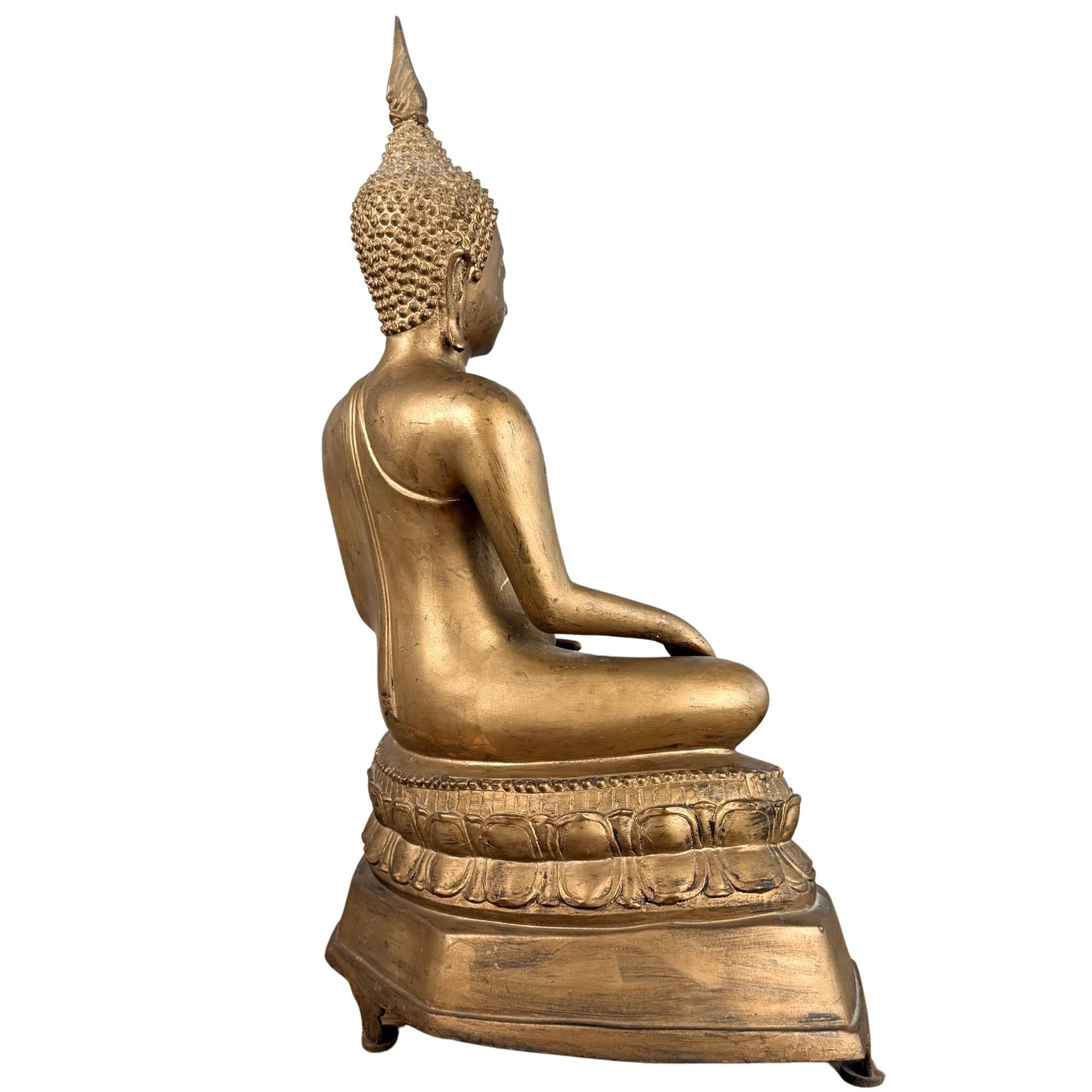 Bronze Buddha statue in Thai temple style with classic lotus base