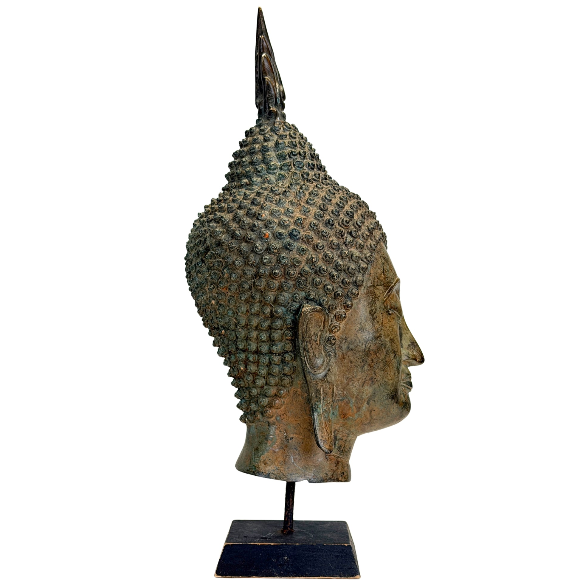 Bronze Buddha head from Thailand with long earlobes and serene appearance