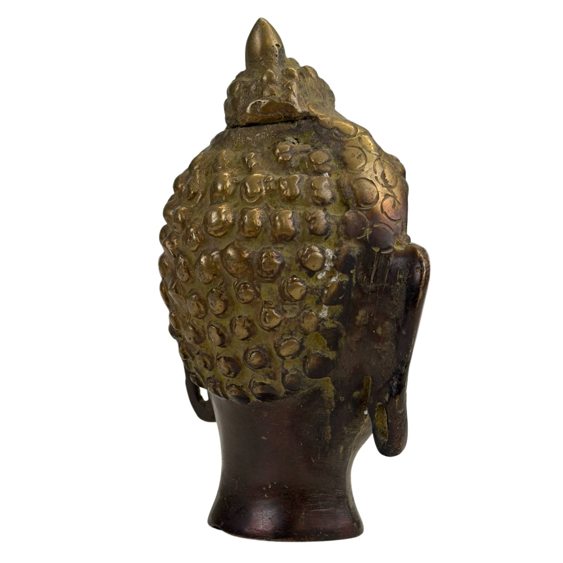 Side profile of bronze Buddha head with elegant contours