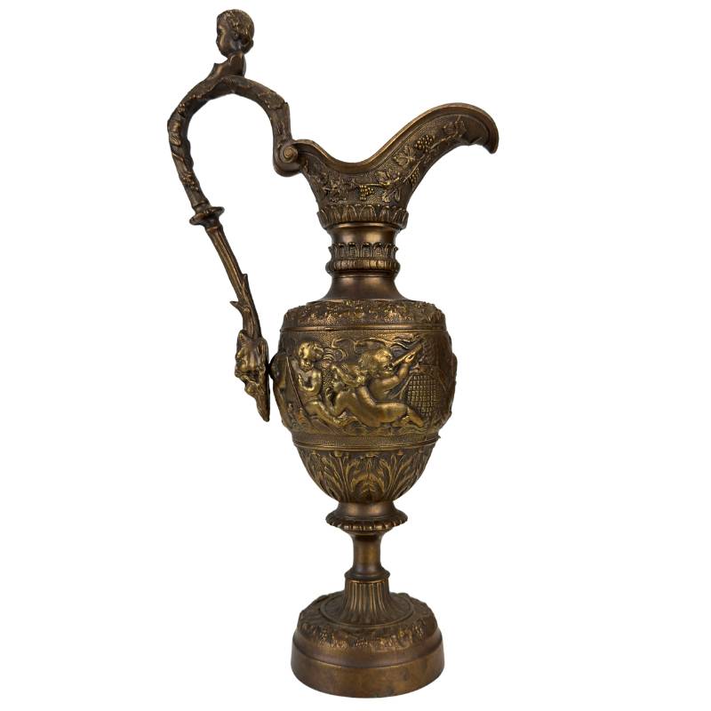 Detail of bronze ewer with putti relief and deep patina