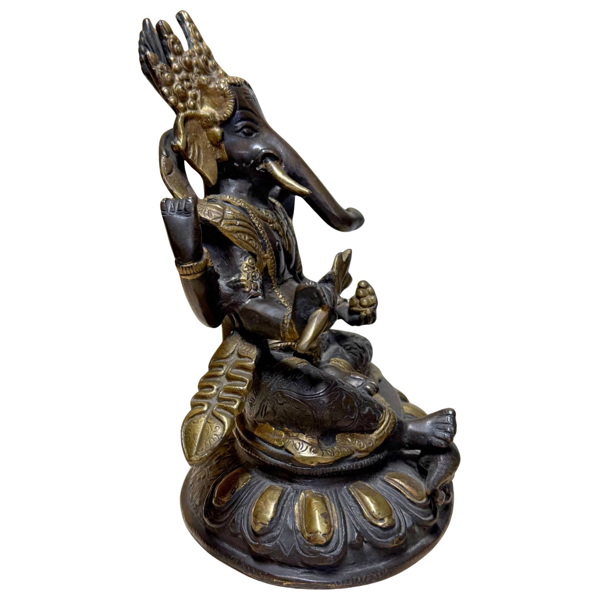 Bronze Ganesha with lotus base, symbol of protection, luck, and inner strength