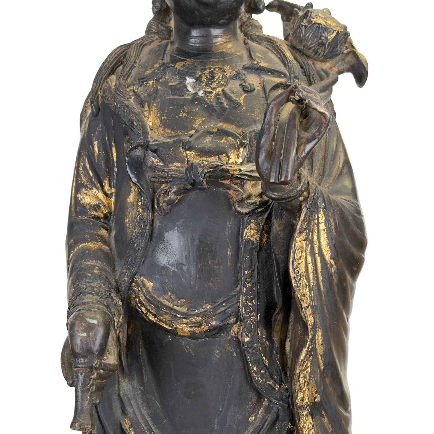 Bronze Guanyin statue on a dragonfish with an old dark patina and a powerful East Asian appearance.