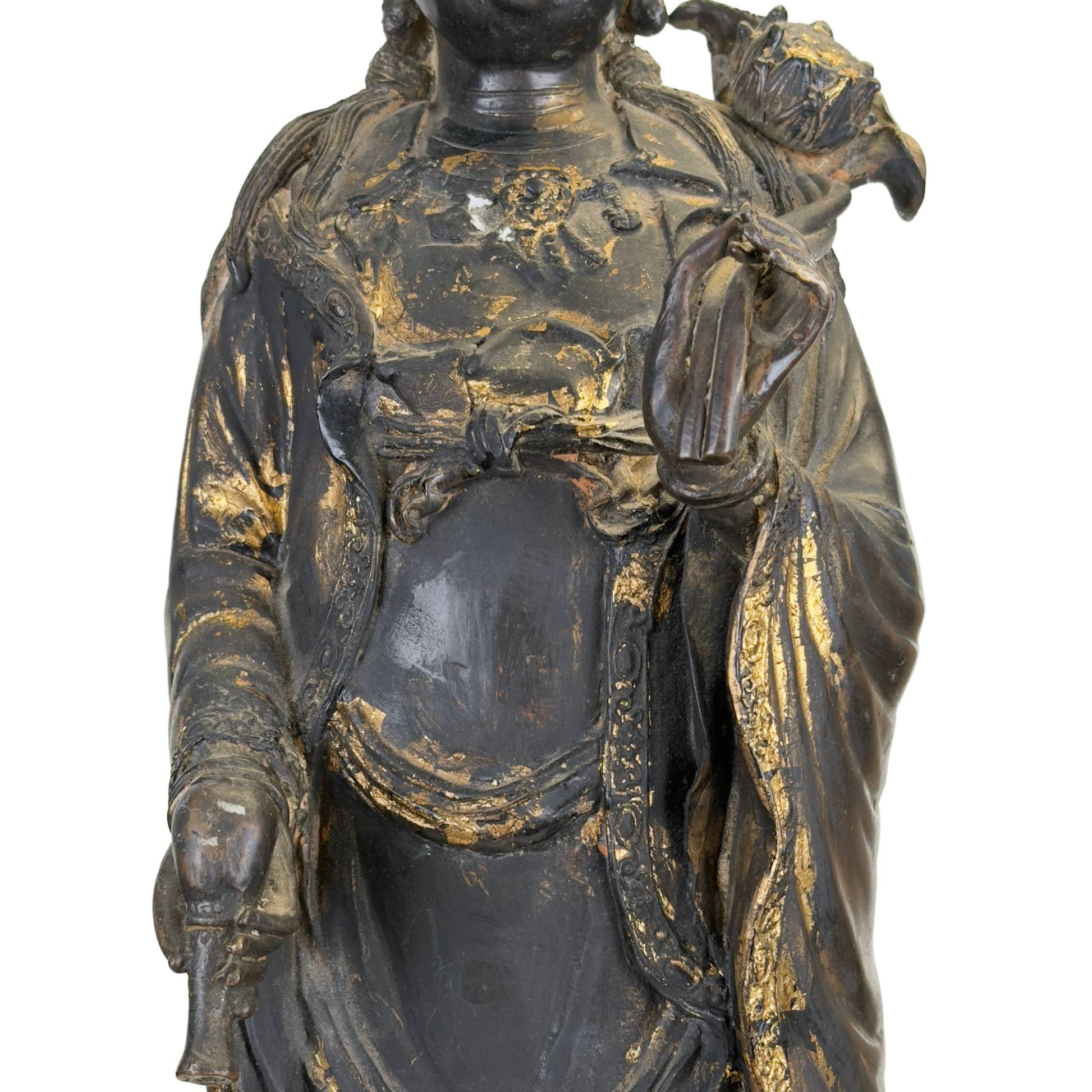 Bronze Guanyin statue on a dragonfish with an old dark patina and a powerful East Asian appearance.