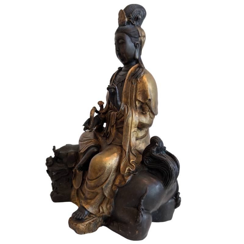 Bronze Guanyin on a lion from China