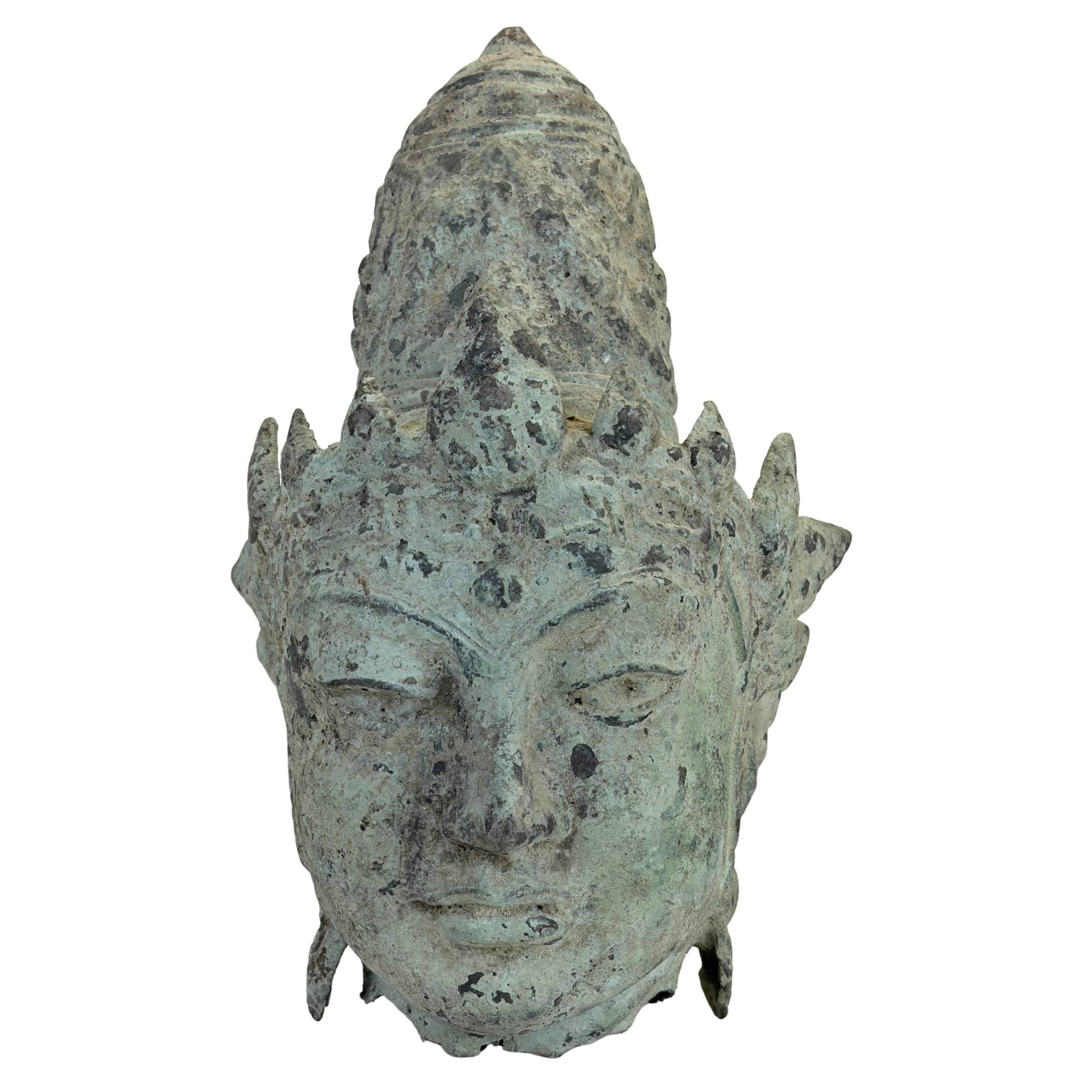 Bronze head of Vishnu from Java in Majapahit tradition with natural verdigris patina
