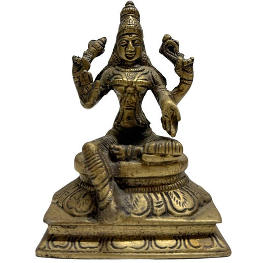 Bronze statue of the Hindu goddess Lakshmi sitting on a lotus throne
