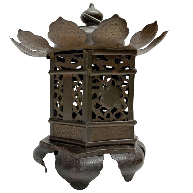 Bronze ritual lantern with hinged doors, openwork floral motifs and antique metal finish