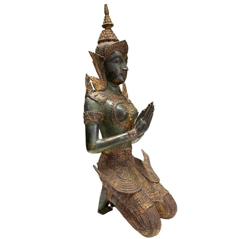 Antique Thai temple guards made of bronze with fire gilding and historical appearance