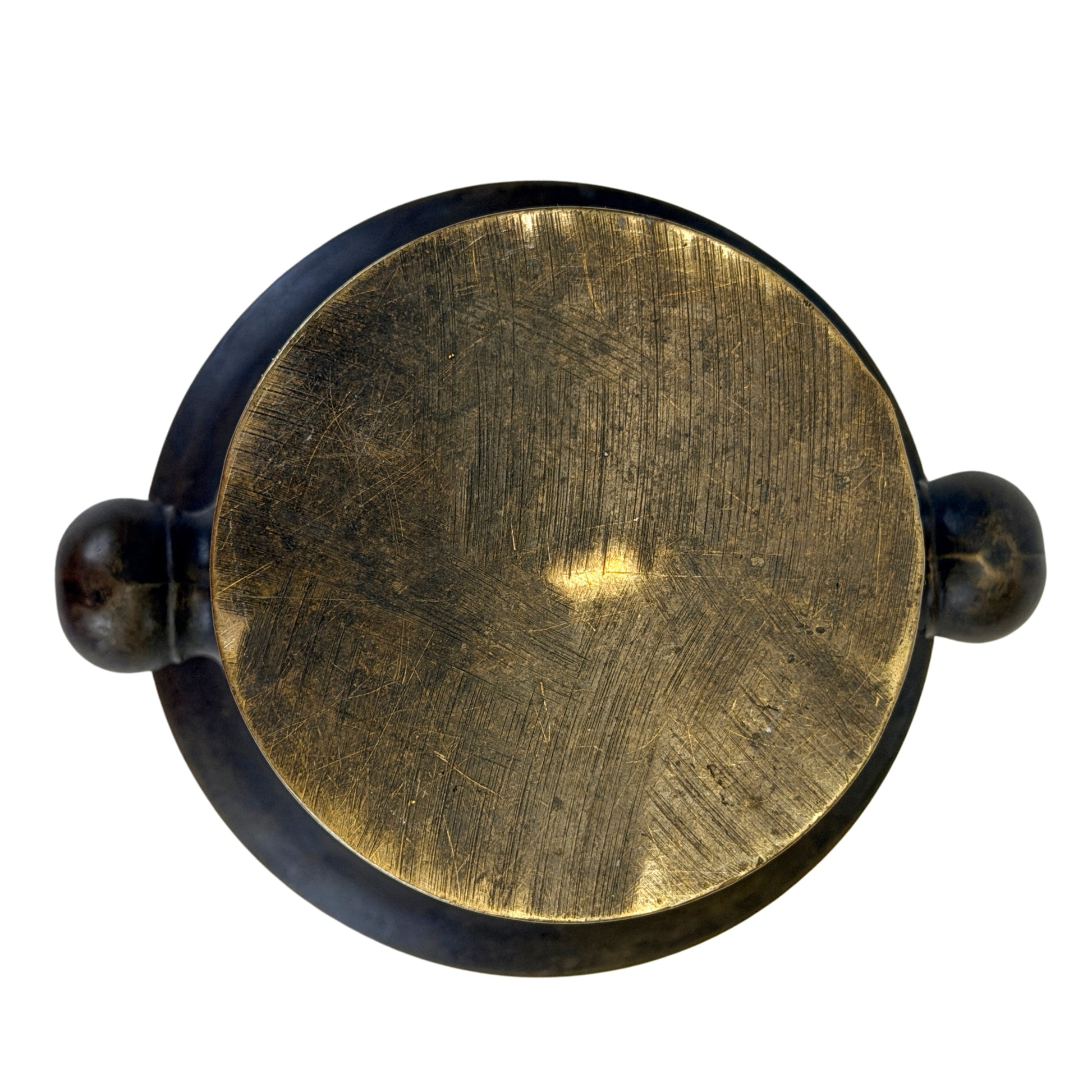 Bottom of antique bronze mortar with old wear and sliding tracks