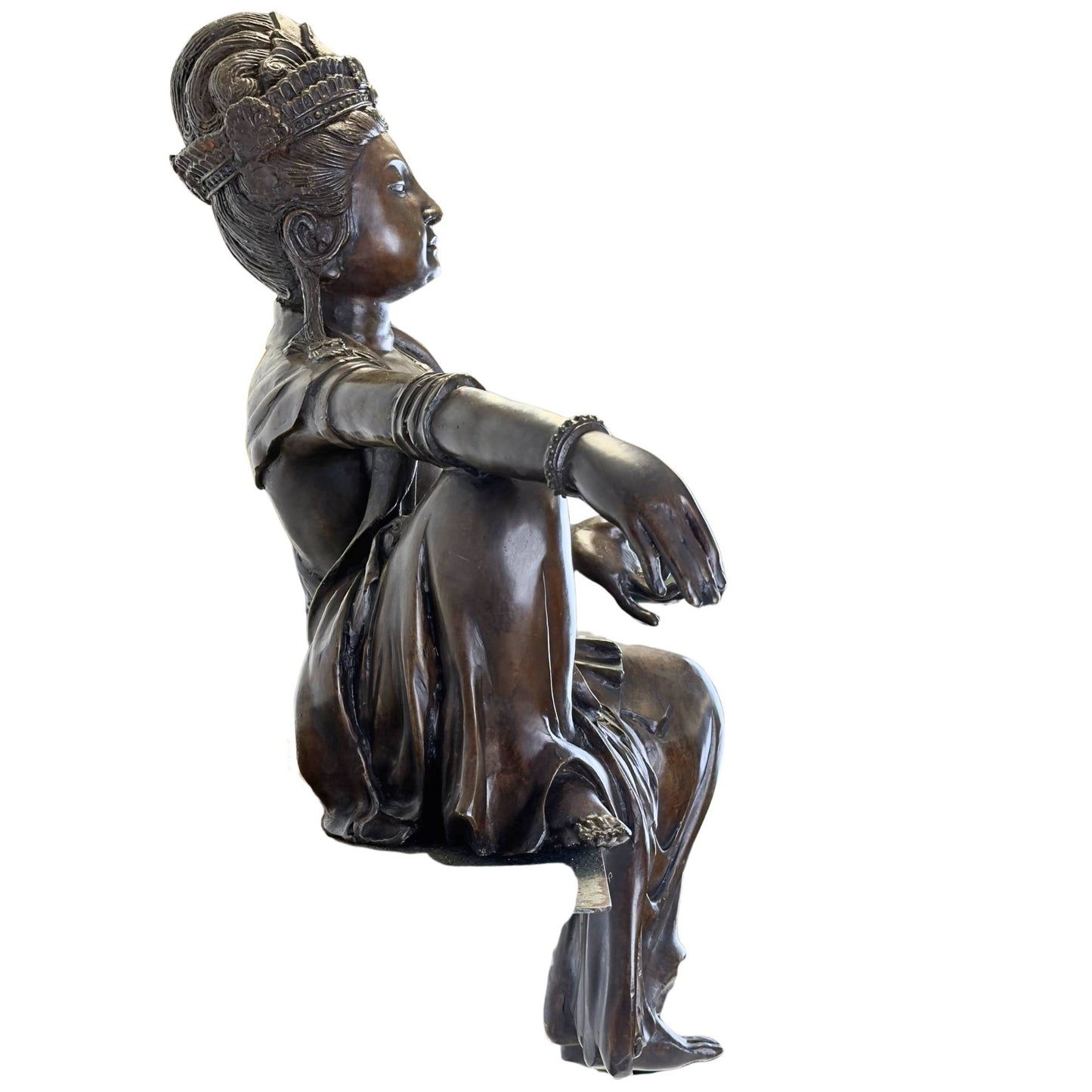 Side view of the 14.6 kg bronze statue showing the flowing drapery of the robe over the edge.