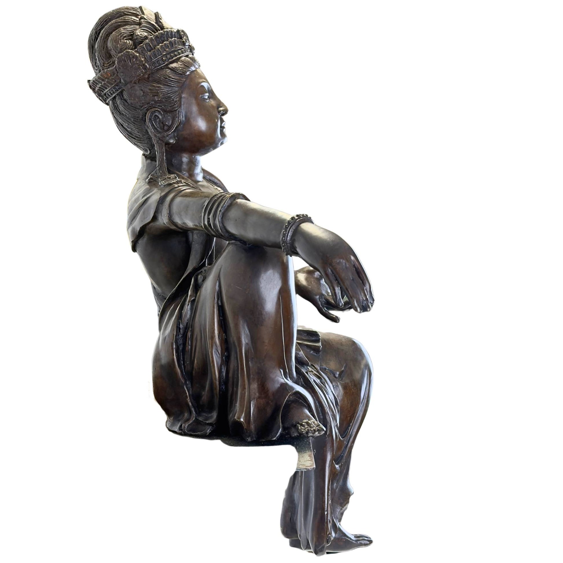 Side view of the 14.6 kg bronze statue showing the flowing drapery of the robe over the edge.