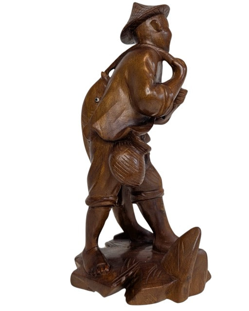 Antique Chinese boxwood carving of a fisherman with a fish