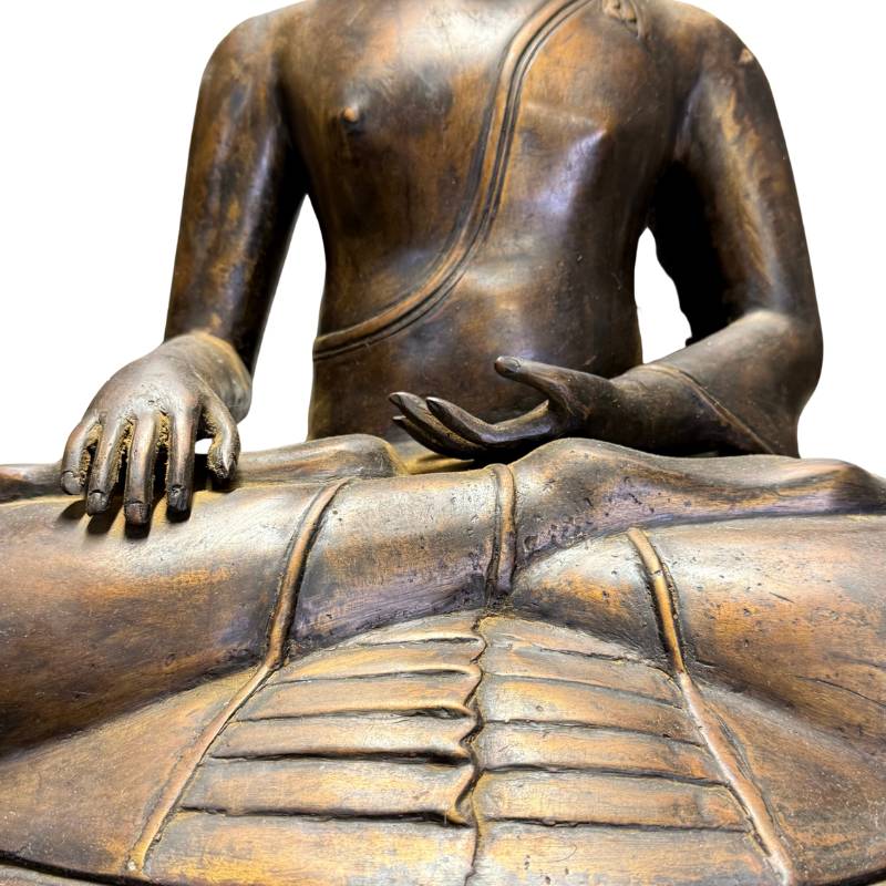 Buddha statue executed in the classical Javanese Candi temple architecture style.