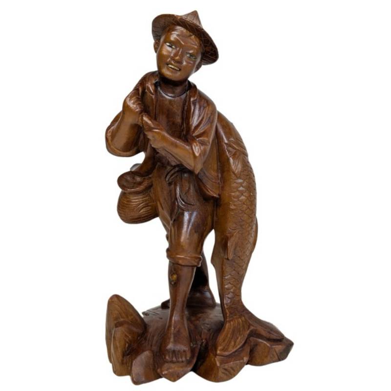 Chinese wood carving fisherman with large carp symbol of good luck