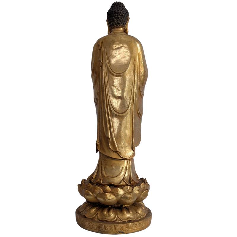 Chinese standing Buddha statue in gilded bronze on a lotus base