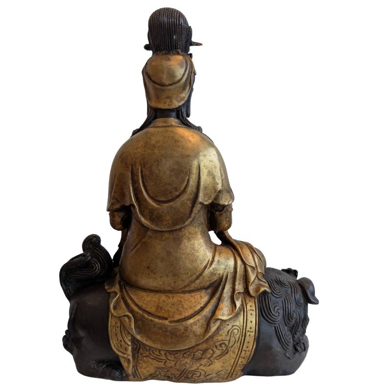Chinese bronze Guanyin with protective lion