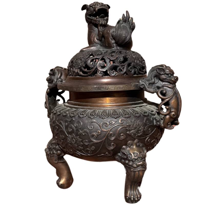 Chinese bronze incense burner with floral engravings
