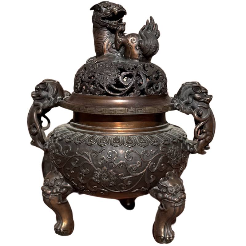 Chinese bronze incense burner on lion's paws

