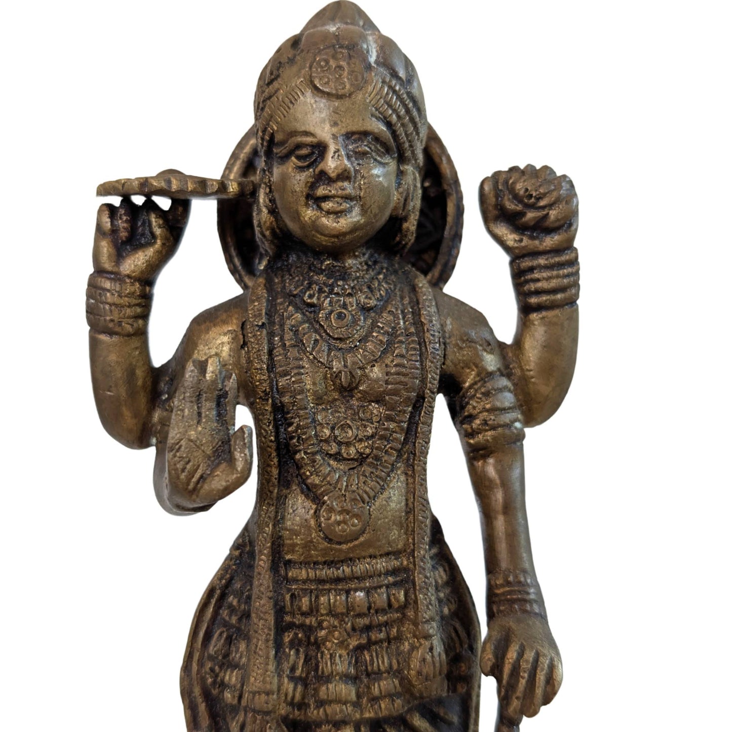 Detailed view of the face and crown of the ancient South Indian Vishnu