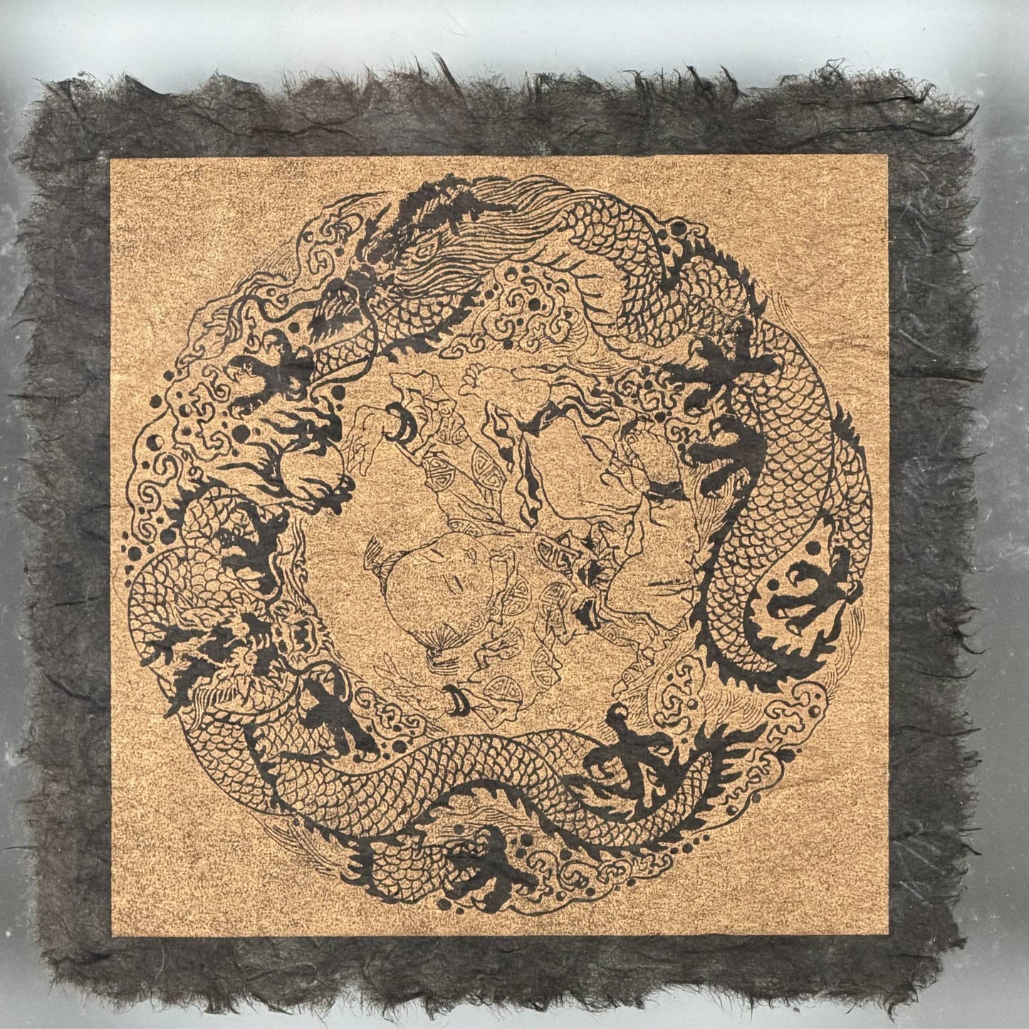 Finely detailed woodcut block print of two Chinese dragons hunting the flaming pearl, printed with traditional soot ink.