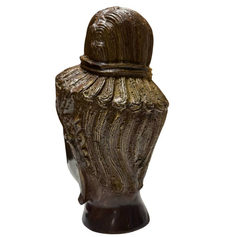 Decorative bronze Buddha head with dark patina and understated appearance